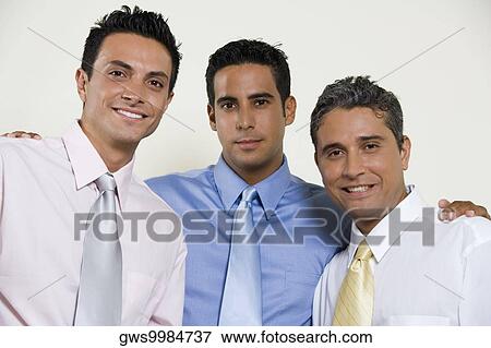 Portrait of three businessmen smiling View Large Photo Image Stock Photo - Portrait of three businessmen smiling. Fotosearch