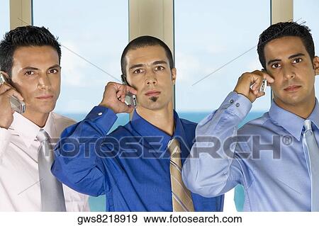 Portrait of three businessmen talking on mobile phones View Large Photo Image Stock Photo - Portrait of three businessmen talking on mobile phones. Fotosearch