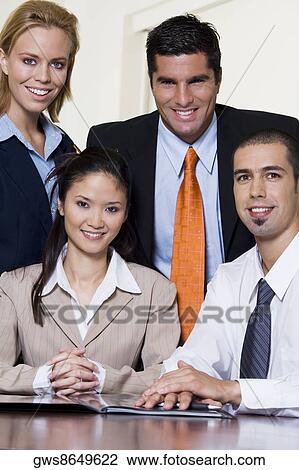 Portrait of two businessmen and two businesswomen View Large Photo Image Stock Image - Portrait of two businessmen and two businesswomen. Fotosearch