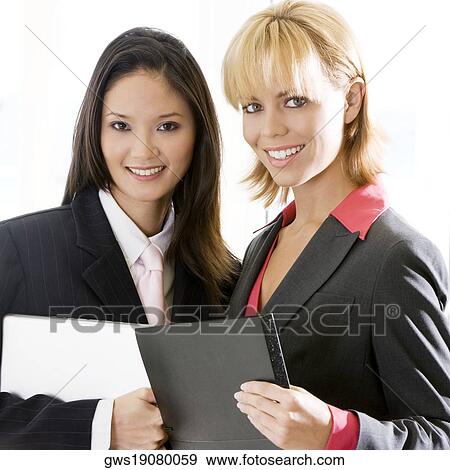 Portrait of two businesswomen smiling View Large Photo Image Stock Photo - Portrait of two businesswomen smiling. Fotosearch