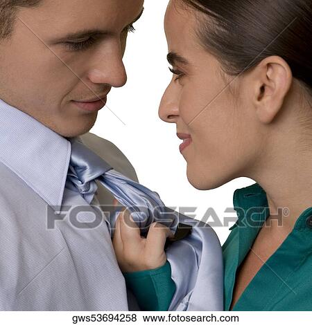 Side profile of a businesswoman holding a businessman by his tie View Large Photo Image Stock Photo - Side profile of a businesswoman holding a businessman by his tie. Fotosearch