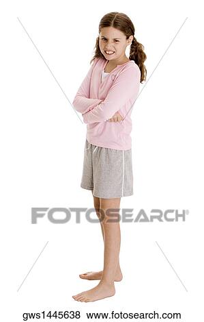 Side profile of a girl standing with her arms crossed View Large Photo Image Stock Photo - Side profile of a girl standing with her arms crossed. Fotosearch