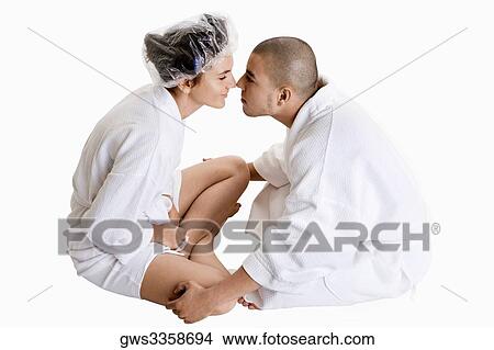 Side profile of a young couple nuzzling View Large Photo Image Picture - Side profile of a young couple nuzzling. Fotosearch
