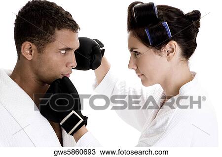 Side profile of a young couple sparring View Large Photo Image Stock Image - Side profile of a young couple sparring. Fotosearch