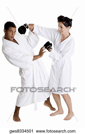 Side profile of a young couple sparring View Large Photo Image Stock Image - Side profile of a young couple sparring. Fotosearch