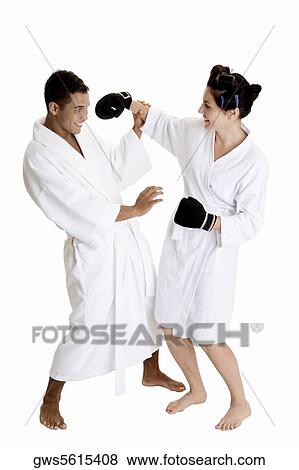 Stock Photo - Side profile of a young couple sparring. Fotosearch