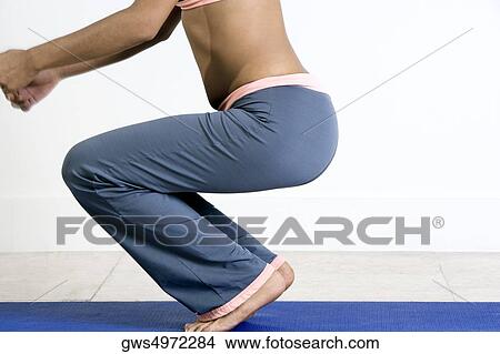 Side profile of a young woman exercising View Large Photo Image Picture - Side profile of a young woman exercising. Fotosearch