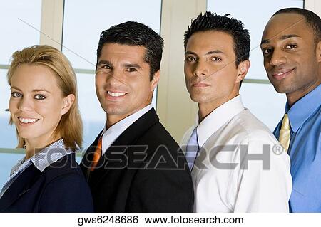 Side profile of three businessmen and a businesswoman standing in a row View Large Photo Image Stock Photograph - Side profile of three businessmen and a businesswoman standing in a row. Fotosearch