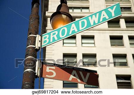 Sign board in front of a building, New York City, New York State, USA View Large Photo Image Picture - Sign board in front of a building, New York City, New York State, USA. Fotosearch