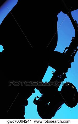 Silhouette of a musician playing the saxophone View Large Photo Image Stock Image - Silhouette of a musician playing the saxophone. Fotosearch