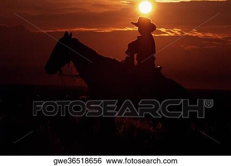 Silhouette of a person riding horseback at sunset View Large Photo Image Stock Photograph - Silhouette of a person riding horseback at sunset. Fotosearch