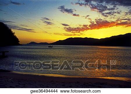 Picture - Silhouette of mountains at dusk. Fotosearch