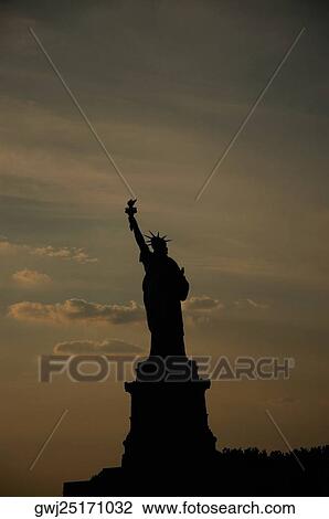 Stock Image - Silhouette of the Statue Of Liberty, New York City, New York State, USA. Fotosearch