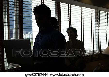 Three business executive in an office View Large Photo Image Picture - Three business executive in an office. Fotosearch