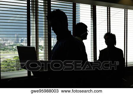 Three business executive in an office View Large Photo Image Stock Image - Three business executive in an office. Fotosearch
