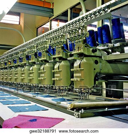 Stock Image - Towel manufacturing equipment in a factory. Fotosearch