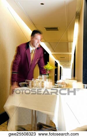 Waiter serving food View Large Photo Image Stock Image - Waiter serving food. Fotosearch