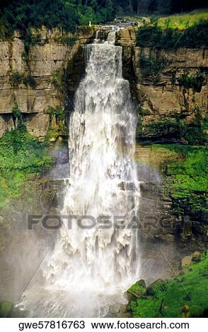 Stock Image - Water flowing from a cliff. Fotosearch