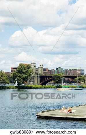 Woman on the dock in front of a bridge, Longfellow Bridge, Charles River, Boston, Massachusetts, USA View Large Photo Image Stock Photo - Woman on the dock in front of a bridge, Longfellow Bridge, Charles River, Boston, Massachusetts, USA. Fotosearch