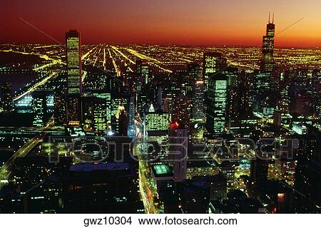 Aerial view of a city lit up at night, John Hancock Building, Chicago, Illinois, USA View Large Photo Image Picture - Aerial view of a city lit up at night, John Hancock Building, Chicago, Illinois, USA. Fotosearch