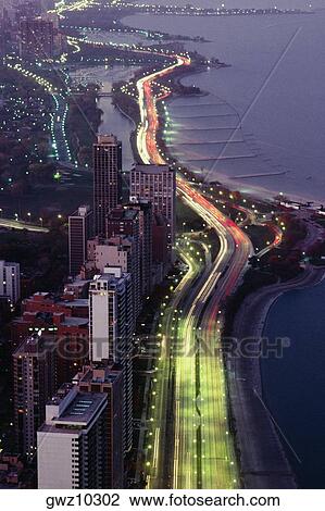 Aerial view of buildings along a highway in a city, Lake Michigan, Chicago, USA View Large Photo Image Stock Image - Aerial view of buildings along a highway in a city, Lake Michigan, Chicago, USA. Fotosearch