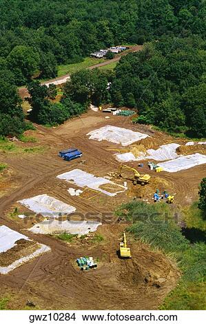 Aerial view of bulldozers on a landscape View Large Photo Image Picture - Aerial view of bulldozers on a landscape. Fotosearch
