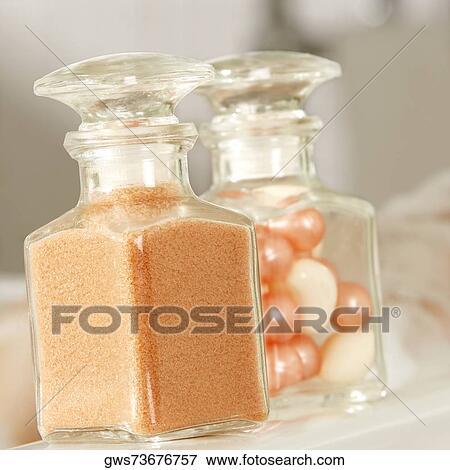 Close-up of a bath powder and bath pearls in glass bottles View Large Photo Image Stock Photo - Close-up of a bath powder and bath pearls in glass bottles. Fotosearch