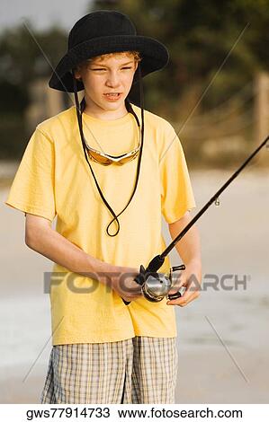 Close-up of a boy fishing View Large Photo Image Stock Image - Close-up of a boy fishing. Fotosearch