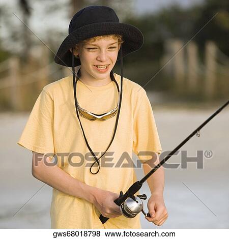 Close-up of a boy fishing View Large Photo Image Stock Photo - Close-up of a boy fishing. Fotosearch