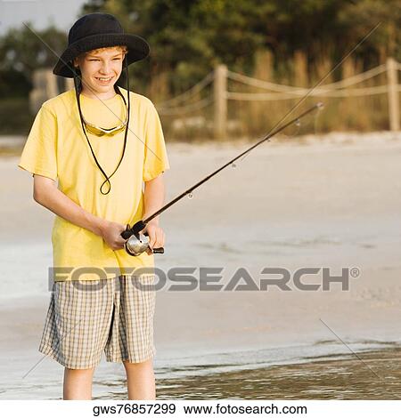Close-up of a boy fishing View Large Photo Image Stock Photo - Close-up of a boy fishing. Fotosearch