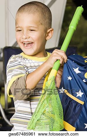 Close-up of a boy holding a butterfly net and a bag View Large Photo Image Stock Image - Close-up of a boy holding a butterfly net and a bag. Fotosearch