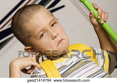 Close-up of a boy making a face View Large Photo Image Picture - Close-up of a boy making a face. Fotosearch