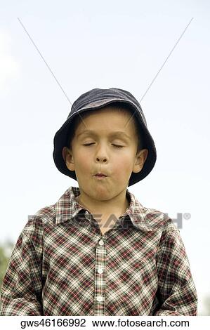 Close-up of a boy making a face View Large Photo Image Stock Image - Close-up of a boy making a face. Fotosearch