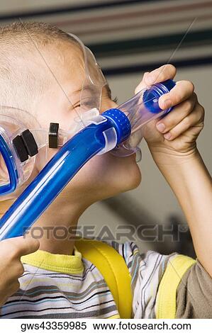 Close-up of a boy wearing a snorkel View Large Photo Image Stock Photography - Close-up of a boy wearing a snorkel. Fotosearch