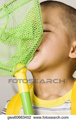 Close-up of a boy with a butterfly net View Large Photo Image Stock Image - Close-up of a boy with a butterfly net. Fotosearch