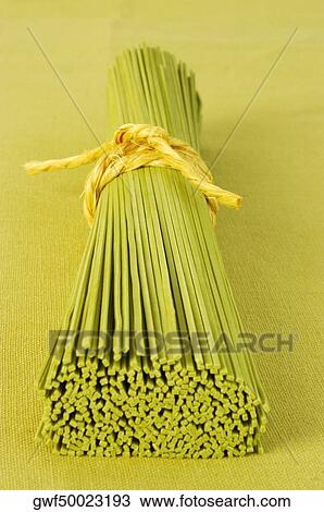 Close-up of a bundle of raw spaghetti View Large Photo Image Stock Image - Close-up of a bundle of raw spaghetti. Fotosearch