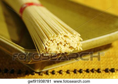 Close-up of a bundle of raw spaghetti View Large Photo Image Stock Image - Close-up of a bundle of raw spaghetti. Fotosearch