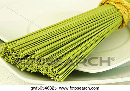 Close-up of a bundle of raw spaghetti View Large Photo Image Stock Photography - Close-up of a bundle of raw spaghetti. Fotosearch