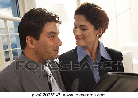 Stock Photo - Close-up of a businessman and a businesswoman. Fotosearch