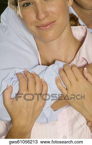 Close-up of a businessman embracing a businesswoman View Large Photo Image Stock Image - Close-up of a businessman embracing a businesswoman. Fotosearch
