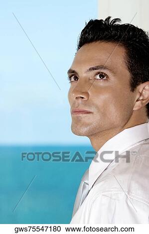 Close-up of a businessman looking serious View Large Photo Image Stock Image - Close-up of a businessman looking serious. Fotosearch