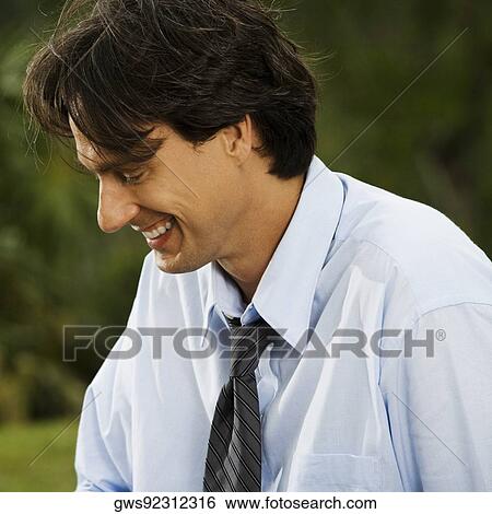 Stock Photograph - Close-up of a businessman smiling. Fotosearch