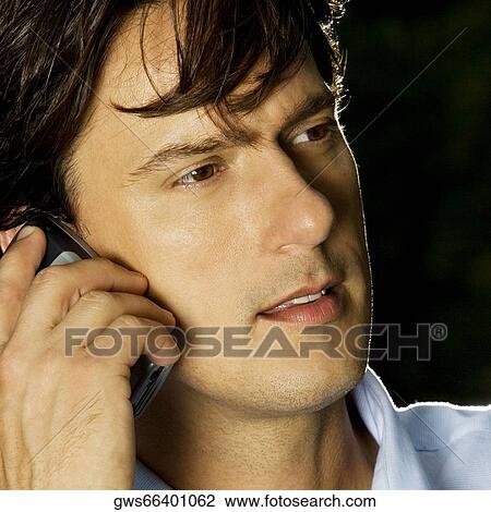 Close-up of a businessman talking on a mobile phone View Large Photo Image Stock Image - Close-up of a businessman talking on a mobile phone. Fotosearch