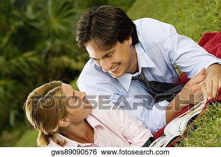 Close-up of a businesswoman and a businessman looking at each other View Large Photo Image Stock Photograph - Close-up of a businesswoman and a businessman looking at each other. Fotosearch