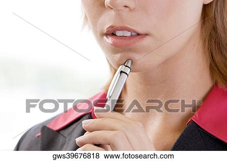 Close-up of a businesswoman holding a pen View Large Photo Image Stock Photo - Close-up of a businesswoman holding a pen. Fotosearch