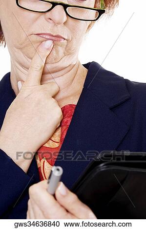 Close-up of a businesswoman thinking View Large Photo Image Stock Image - Close-up of a businesswoman thinking. Fotosearch