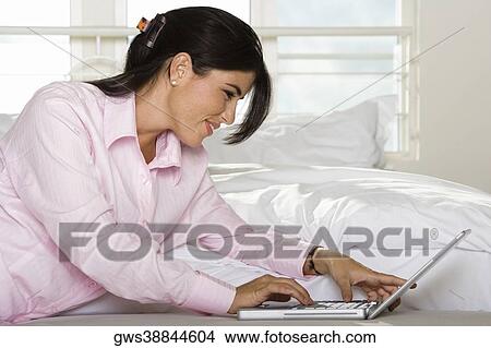 Close-up of a businesswoman using a laptop View Large Photo Image Picture - Close-up of a businesswoman using a laptop. Fotosearch