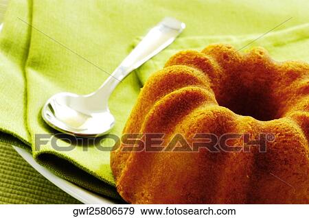 Stock Photo - Close-up of a cake and a spoon. Fotosearch