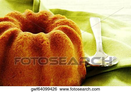Close-up of a cake and a spoon View Large Photo Image Stock Photograph - Close-up of a cake and a spoon. Fotosearch