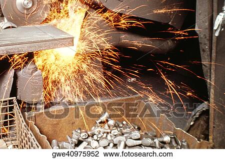 Stock Image - Close-up of a circular saw cutting a metal piece, Wisconsin, USA. Fotosearch